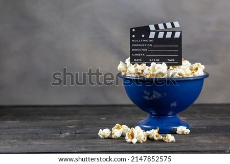 Movie Clapper Board and Popcorn	