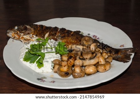 Fried trout with mushroom on a dish Royalty-Free Stock Photo #2147854969