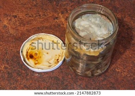 spoiled canned food in a jar, mold spores in a jar