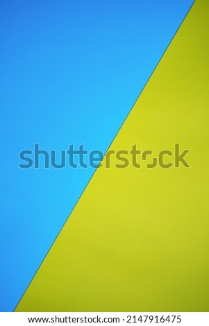 Abstract blue yellow background. Colors of the flag of Ukraine. Textured paper