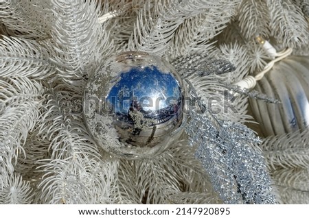 Christmas toys on the artificial Tree, white