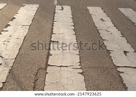 Pavement signs in the sunset