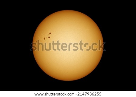 Sun in dark space with solar spots on the 20th April 2022 Royalty-Free Stock Photo #2147936255