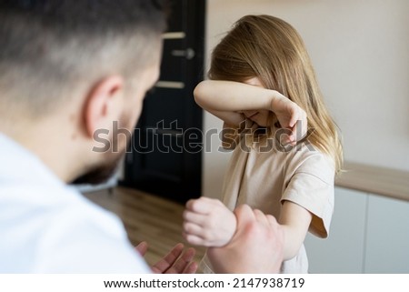 The concept of violence and abuse in the family. Father punishing his child. Royalty-Free Stock Photo #2147938719