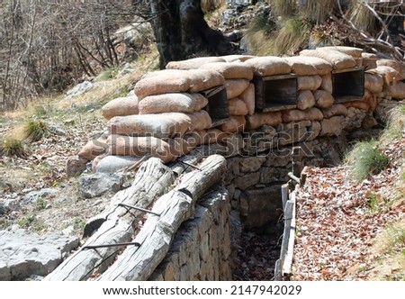 sandbags for the protection of the trenches dug into the rock by the soldiers  during the war Royalty-Free Stock Photo #2147942029