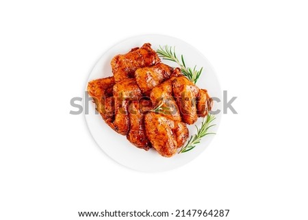 Marinated chicken wings in red sauce on isolated white background.Top view.Copy space.Semifinished. Fast cooking.Raw marinated chicken meat. Royalty-Free Stock Photo #2147964287