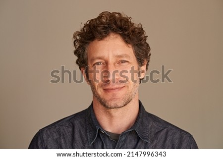 Hes the modern man. Portrait of a handsome young man in the studio. Royalty-Free Stock Photo #2147996343