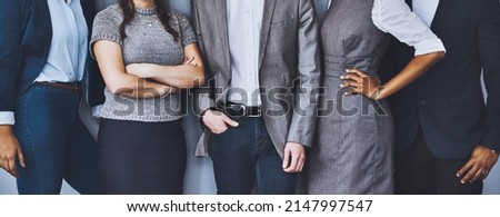 Confident theyre right for the job. Cropped shot of a group of unrecognizable businesspeople waiting in line for their interviews.