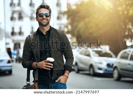 That urban feeling. Cropped shot of a handsome young man traveling through the city. Royalty-Free Stock Photo #2147997697