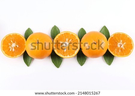 Flat lay decoration of fresh Orange slice fruits isolated over white background shoot photography in High angle view
