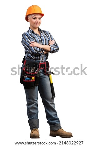 Attractive female construction worker in hardhat standing with folded arms. Confident young specialist in checkered blue shirt isolated on white background. Industrial manufacturing and construction