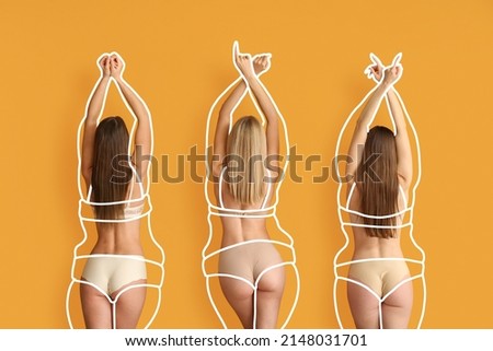 Beautiful young women after weight loss on orange background Royalty-Free Stock Photo #2148031701