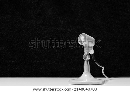 black and white background with vintage microphone