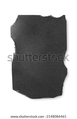 Black burnt paper on a white background. Design elements or portfolio. Copy space. Isolated on white