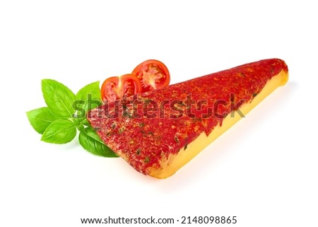 Hard cheese with red sun-dried tomatoes, herbs, basil, isolated on white background