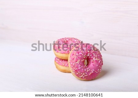 Pink donats, Sweet breakfast. Stack of pink and white donats