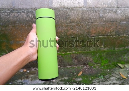 green thermos to hold hot water