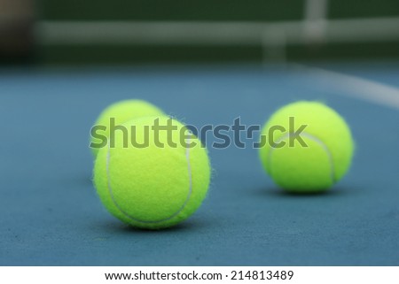 Yellow Tennis ball on the blue court