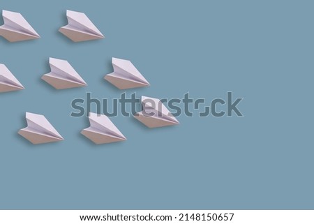 Set of paper planes. Isolated on a blue background