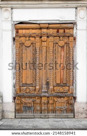Doors and entrance to an old building. Ancient medieval old wooden massive door.