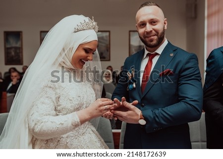 Groom Put on Wedding Ring Bride Hand. Selective focus . High quality photo