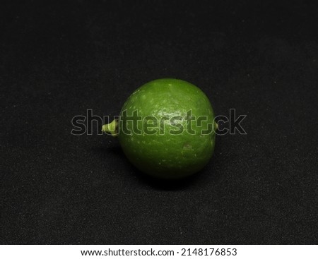 green Lemon fruit. on a black background