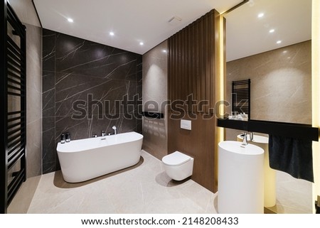 new large bathroom with white bathroom mirror and lighting Royalty-Free Stock Photo #2148208433