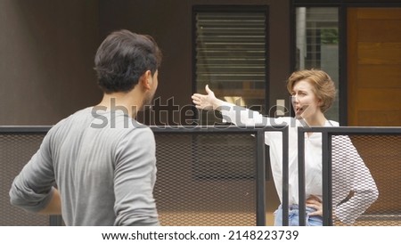 An angry neighbor shouting, blaming, yelling at each other in their homes in village. People. Neighborhood argument Royalty-Free Stock Photo #2148223739