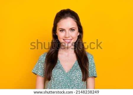 Photo of adorable shiny young woman wear print dress smiling isolated yellow color background