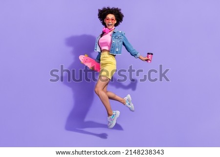 Full length body size view of attractive fit trendy girl jumping having fun action isolated on bright violet purple color background