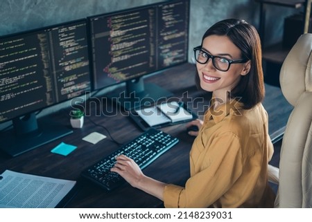 Profile side view portrait of attractive cheerful skilled girl geek developing web site cyber security at workplace workstation indoors Royalty-Free Stock Photo #2148239031