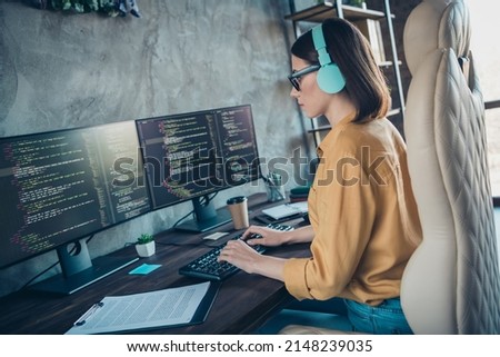 Profile portrait of serious smart web designer sitting chair keyboard write edit database workplace inside Royalty-Free Stock Photo #2148239035