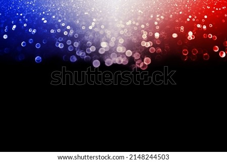 Abstract patriotic red white and blue glitter sparkle confetti black background for party invite, July 4th or 14 firework, memorial flag pattern, USA fourth 4 sale, elect president vote or labor day Royalty-Free Stock Photo #2148244503