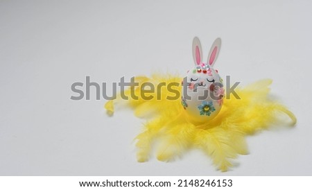 banner. Easter eggs in the form of hares on a white background. Flat styling. Copy the place for the text.