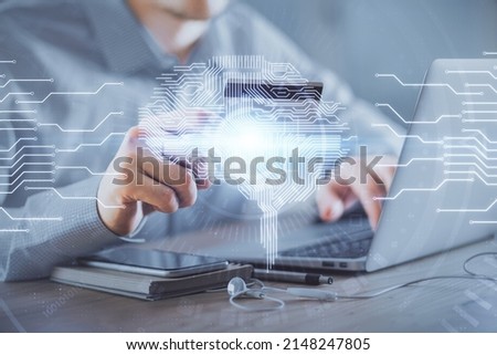 Double exposure of man hands typing on computer with credit card and brain theme drawing. E-commerce and AI concept.