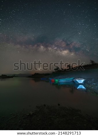 Astro photography and Nightscape photography, Milky way over the boats at Mandan lake, Rajpipla, Gujarat