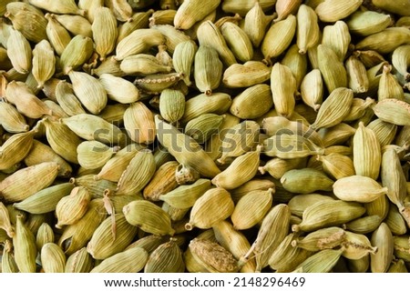 Closeup of a heap of dry green cardamons Royalty-Free Stock Photo #2148296469