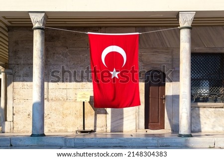Hanging Turkish flag against old building in Istanbul, Turkey.
