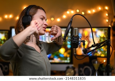 Reading a radio host or blogger text in a home studio into a microphone, radio or broadcast. Working with sound
