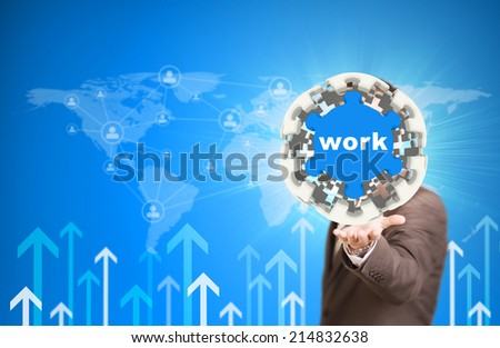 Business man hold puzzle sphere with Work label