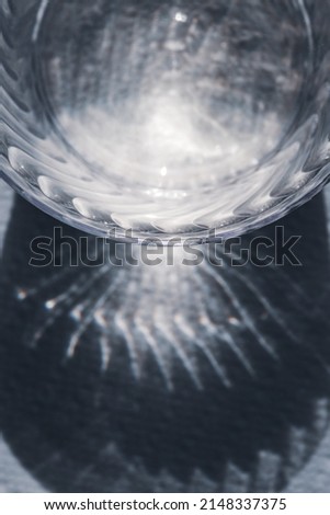 Light reflections off a plastic cup