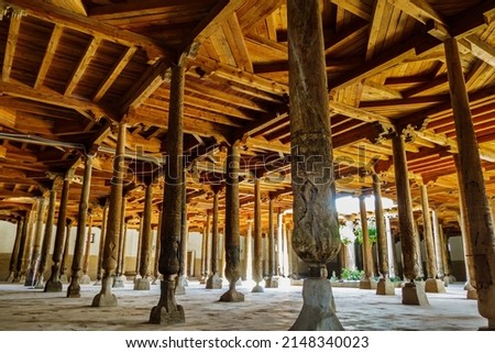 Panorama of wooden columns in the Juma Mosque, Uzbekistan. This is one of the oldest buildings in the city dating back to the 10th century Royalty-Free Stock Photo #2148340023