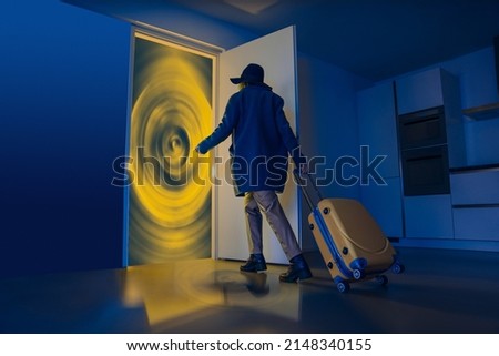 The door is like a portal for travel. Portal to other dimensions. Surrealistic creative work about future travels. The man with the suitcase walks towards the gate in the doorway. Fast travel Royalty-Free Stock Photo #2148340155