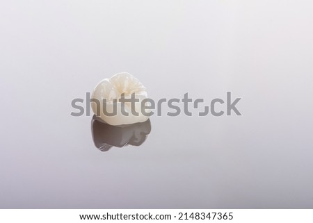 Qualified anatomic ceramic and zirconia crowns of human teeth close up macro isolated on black background. Royalty-Free Stock Photo #2148347365