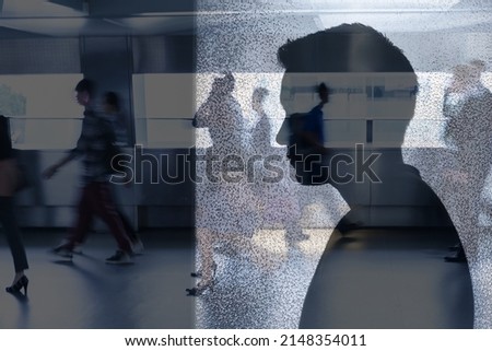 Young man feeing lonely, isolated in a hectic stressful city crowded environment  Royalty-Free Stock Photo #2148354011