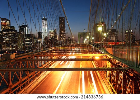 Traffic on the Brooklyn Bridge at night in New York