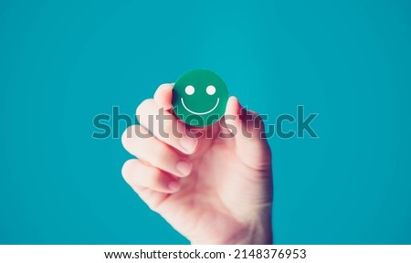 woman holding green smile face good happy emotion Positive Thinking just keep smiling.world mental health day concept.mental health assessment.Mental care employee survey.Health care medical.social.