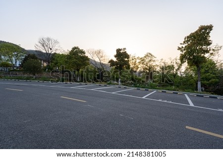 Parking lot in city during sunset