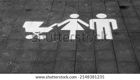 Car parking space reserved for family at shopping mall. Priority parking space for family.