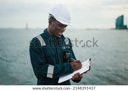 Marine navigational officer or chief mate on navigation watch on ship or vessel Royalty-Free Stock Photo #2148391437
